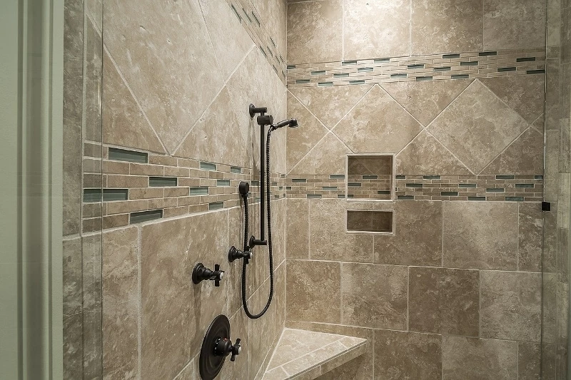 Clean bathroom shower with traditional style and glass doors