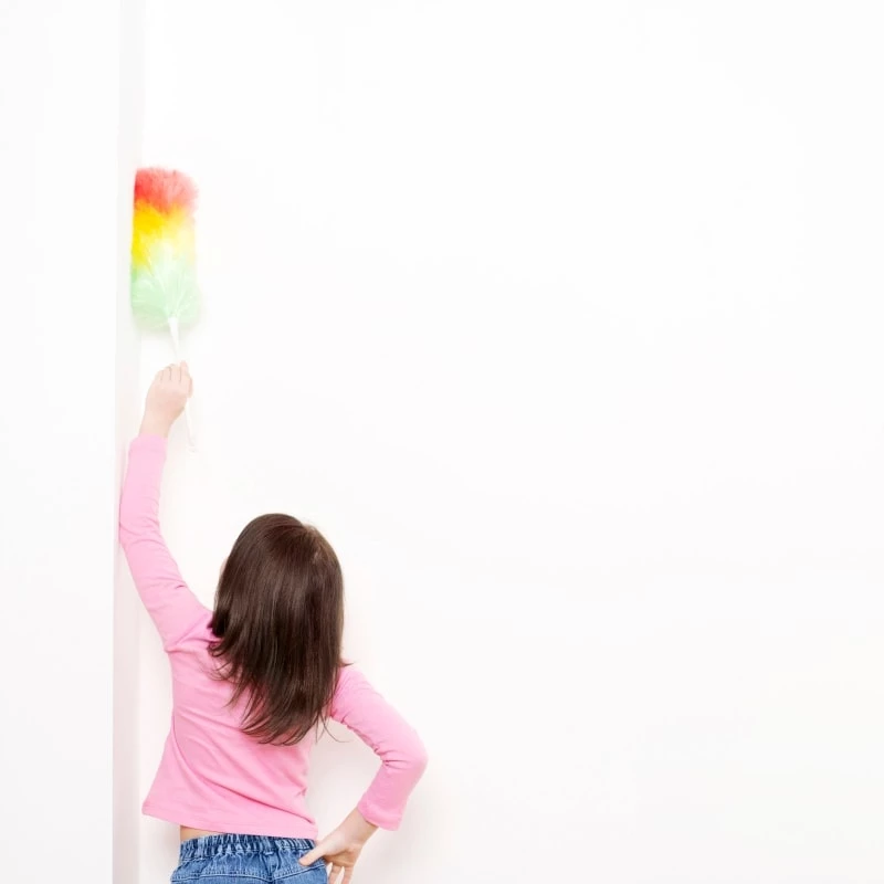 Toddler girl dusting