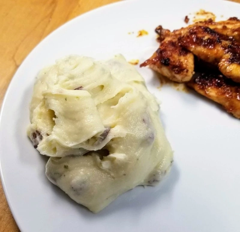 Cheesy and Creamy Instant Pot Mashed Potatoes On A Plate with BBQ Chicken