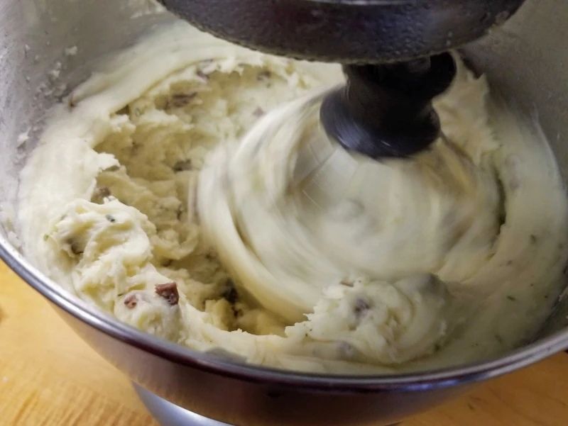 Potatoes being whipped in KitchenAid Mixer