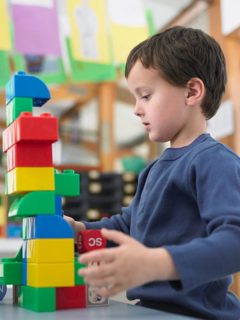 Young boy playing with blocks