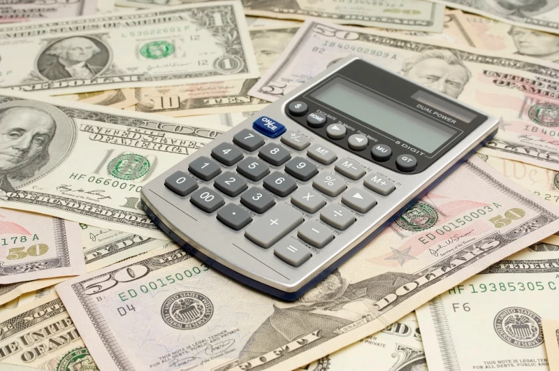 Calculator sitting on money