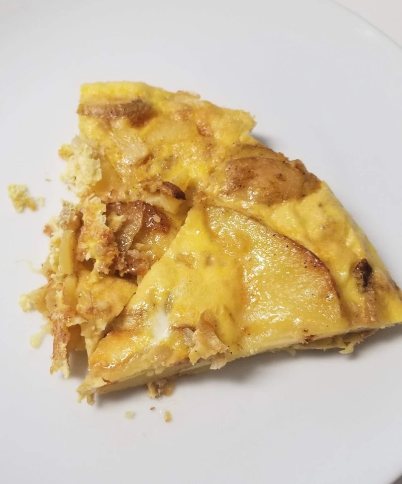 Sliced Spanish Tortilla on a white plate