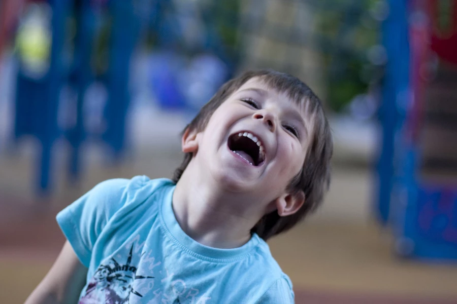 Kid laughing at the park