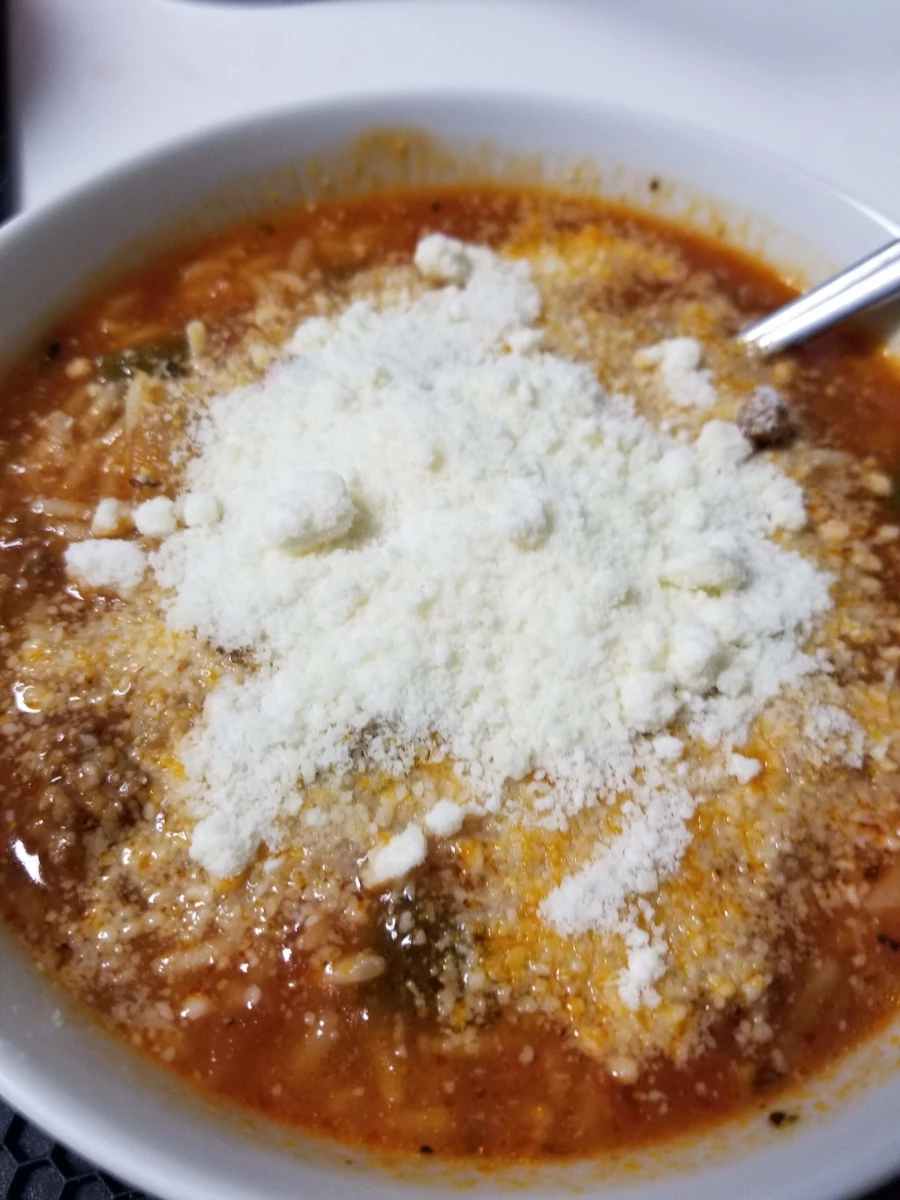 stuffed pepper soup with parmesan cheese sprinkled on top