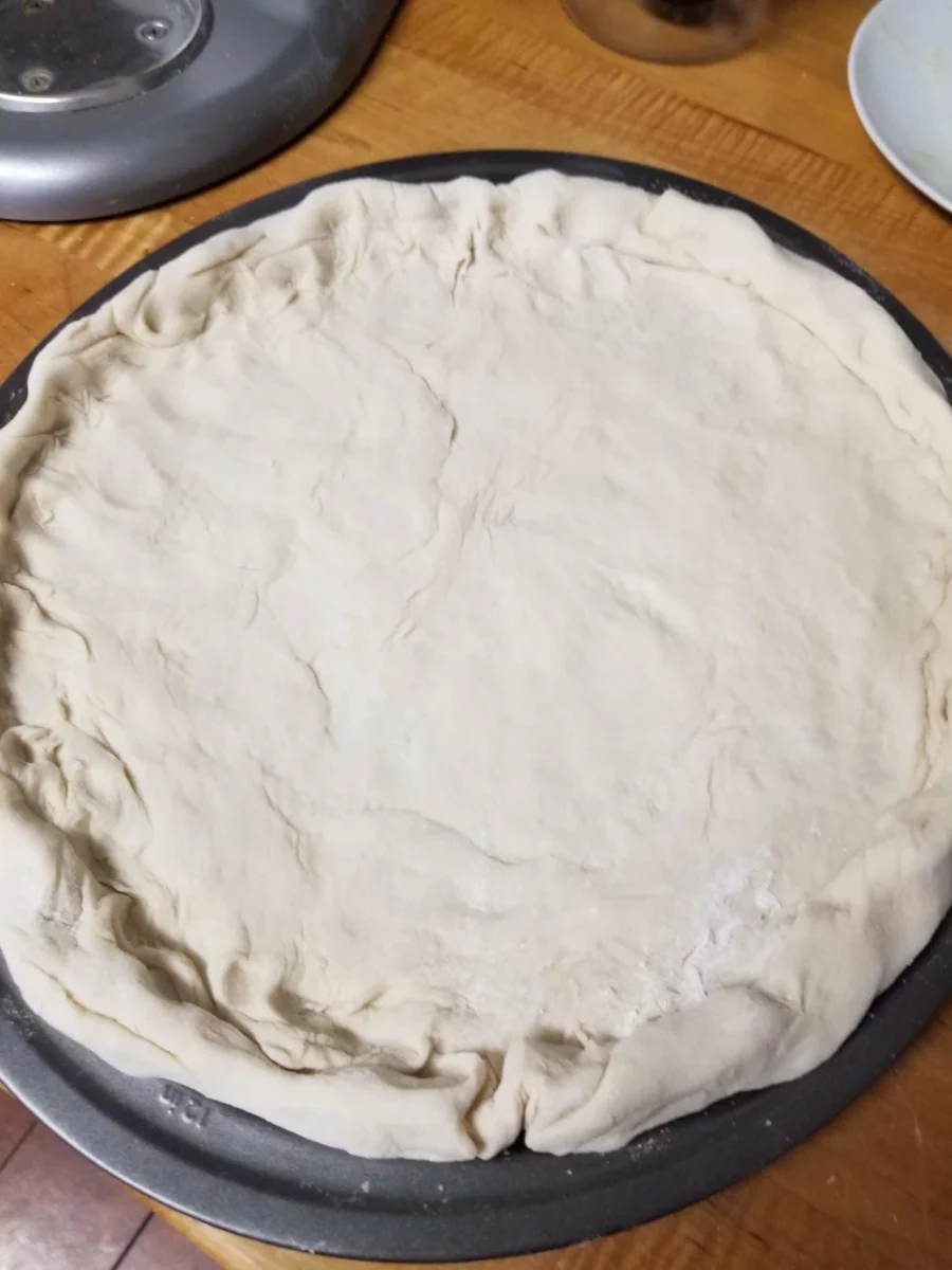 3 - Pizza Dough stretched out over a pan