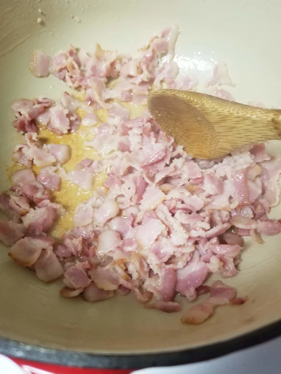 4 - Diced bacon cooking in a dutch oven