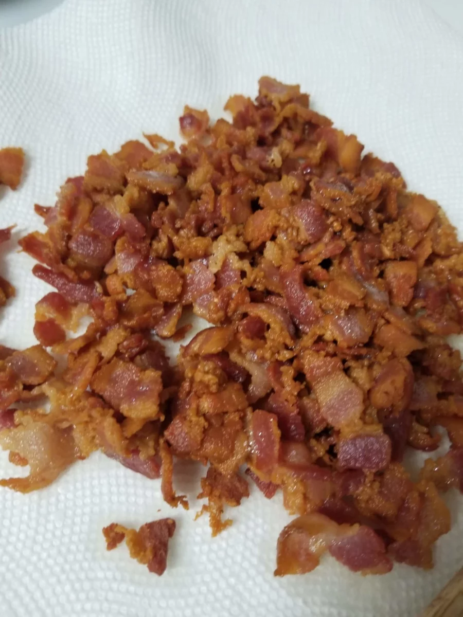 5 - Diced cooked bacon resting on a paper towel lined plate