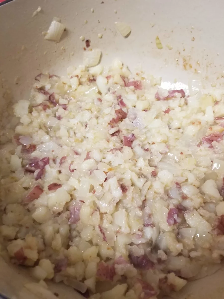 8 - Slightly mashed potatoes with diced onions in a dutch oven