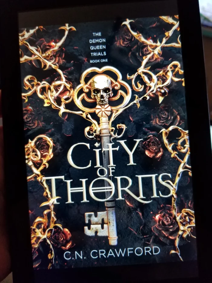 City of Thorns Book Cover on Tablet