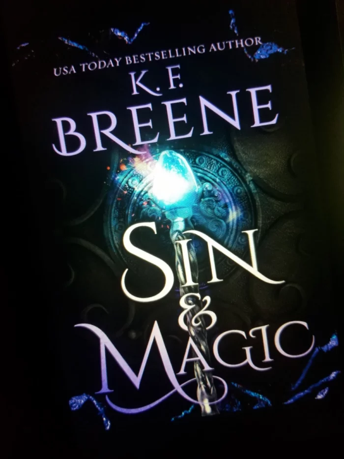 Sin and Magic book cover on tablet